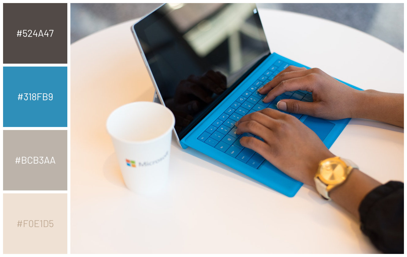 person using microsoft surface tablet with blue detachable keyboard